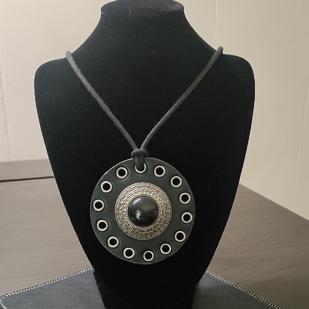 Elegant Black and Silver Pendant On Leather